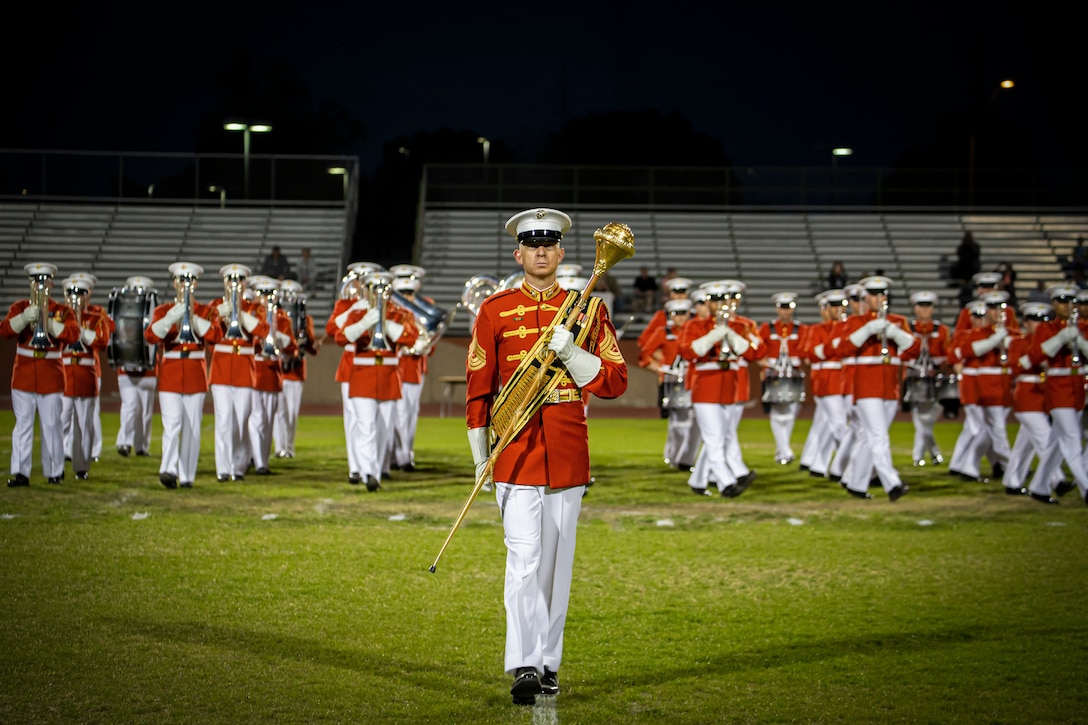 Master Sgt. Joshua Dannemiller, assistant drum major, “The Commandant’s Own,” U.S. Marine Drum & Bugle Corps, marches down the field during a Battle Color Ceremony at Kofa High School, Yuma, Ariz., March 3, 2022.