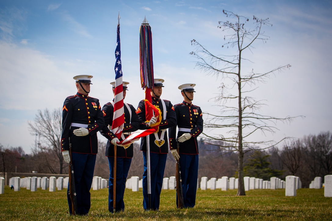 Marines with the Official U.S. Marine Corps Color Guard gather the colors during a funeral for repatriated Marine, Cpl. Thomas H. Cooper, at Arlington National Cemetery, Arlington, Va., March 10, 2022. Cooper, 22, of Chattanooga, Tennessee, was a member of Company A, 2nd Amphibious Tractor Battalion, 2nd Marine Division, which landed against stiff Japanese resistance on the small island of Betio in the Tarawa Atoll of the Gilbert Islands during World War II, and was killed in action. (U.S. Marine Corps photo by Cpl. Tanner D. Lambert)