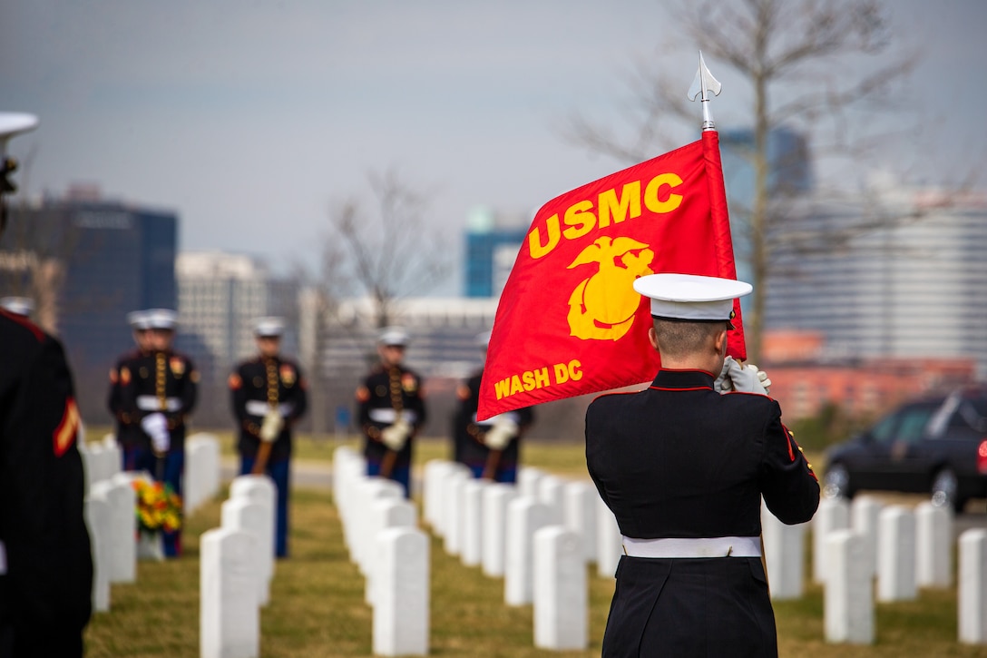 The guidon of Marine Barracks Washington is displayed during a funeral for repatriated Marine, Cpl. Thomas H. Cooper, at Arlington National Cemetery, Arlington, Va., March 10, 2022. Cooper, 22, of Chattanooga, Tennessee, was a member of Company A, 2nd Amphibious Tractor Battalion, 2nd Marine Division, which landed against stiff Japanese resistance on the small island of Betio in the Tarawa Atoll of the Gilbert Islands during World War II, and was killed in action. (U.S. Marine Corps photo by Cpl. Tanner D. Lambert)