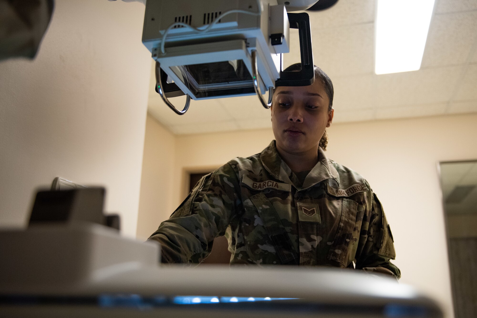 Staff Sgt. Gloria Garcia, an ultrasound technician assigned to the 39th Medical Group, performs a function check on a portable x-ray machine at Incirlik Air Base, Turkey, March 14, 2022. Radiology uses X-rays to photograph human anatomy to assist doctors in identifying potential disease and injury to continue caring for patients. (U.S. Air Force photo by Airman 1st Class Brandt Self)