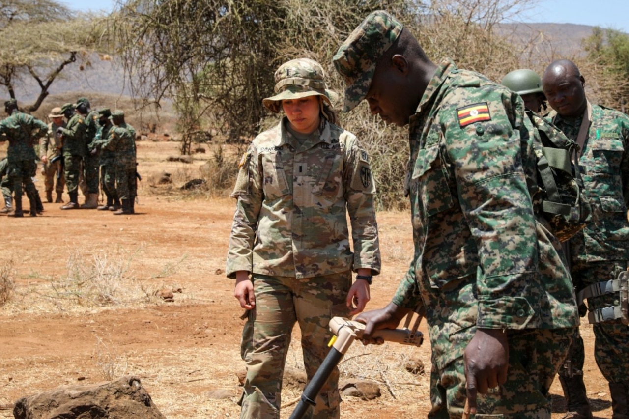 Soldiers stand as a group.