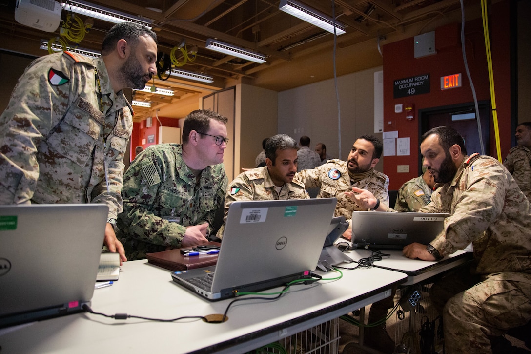 Lt. Cmdr. David Steinberger, U.S. Naval Forces Central Command, and Gulf Cooperation Council (GCC) counterparts, plan notional maritime operations designed to protect commercial ships and ensure freedom of navigation during scenario driven exercise Eagle Resolve 22, at Fort Carson, Colorado, March 14, 2022. Eagle Resolve 22 is an air and missile defense exercise designed to enhance integration among the U.S. and regional partners in the arena of air and missile defense. (U.S. Army photo by Spc. Robert Vicens)