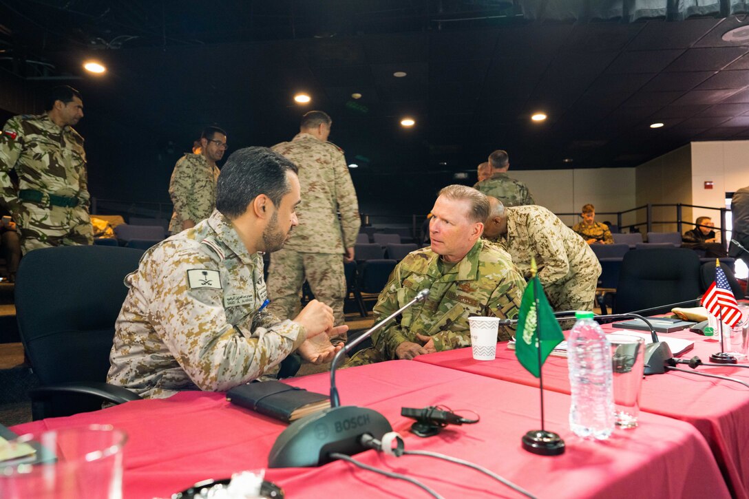 Maj Gen. David J. Meyer, Deputy Commander, 9th Air Force, right, listens to Royal Saudi Air Force Brigadier General Saud A. Al-Rashoud, during a senior leader seminar at exercise Eagle Resolve 22, at Fort Carson, Colorado, March, 10, 2022. The seminar included senior military leaders from the U.S., Kuwait, Bahrain and the Kingdom of Saudi Arabia. Eagle Resolve 22 is an air and missile defense exercise designed to enhance integration among the U.S. and regional partners in the arena of air and missile defense. (U.S. Army photo by Staff Sgt. Leo Jenkins)