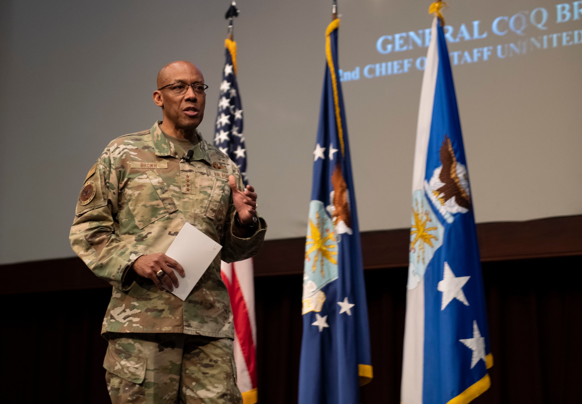 Air Force Chief of Staff Gen. CQ Brown, Jr. is on stage in an auditorium while he speaks to students attending the Air Force Senior Noncommissioned Officer Academy, March 10, 2022.