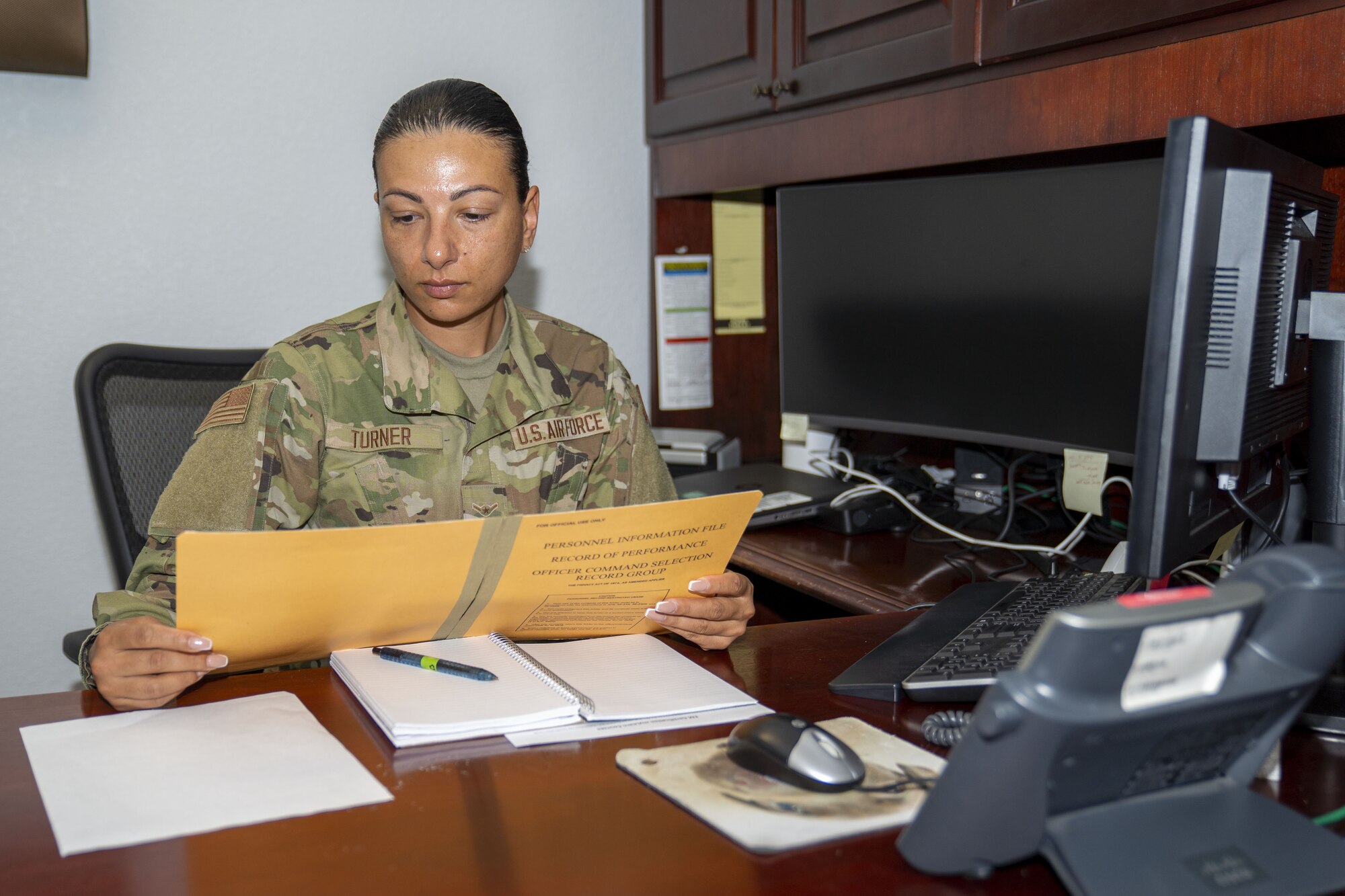 U.S. Air Force Airman 1st Class Gordana Turner, 335th Training Squadron student, reviews paperwork at the Sablich Center on Keesler Air Force Base, Mississippi, March 15, 2022. Turner took part in the Skills Enhancing Development Program, which allows Airmen who have graduated technical training the opportunity to work in their career field's local squadron, while waiting to leave for their first duty station. (U.S. Air Force photo by Senior Airman Kimberly L. Mueller)