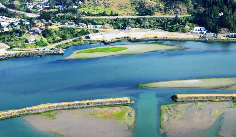 Aerial photo of the Port of Gold Beach, Ore.  entrance, Jun. 24,  2020.

The U.S. Army Corps of Engineers (Corps) maintains navigation channels along the Oregon coast and dredging is an important component of keeping the Rogue River Harbor open for recreational vessels, including jet boats, fishing guides and sport fishermen.
