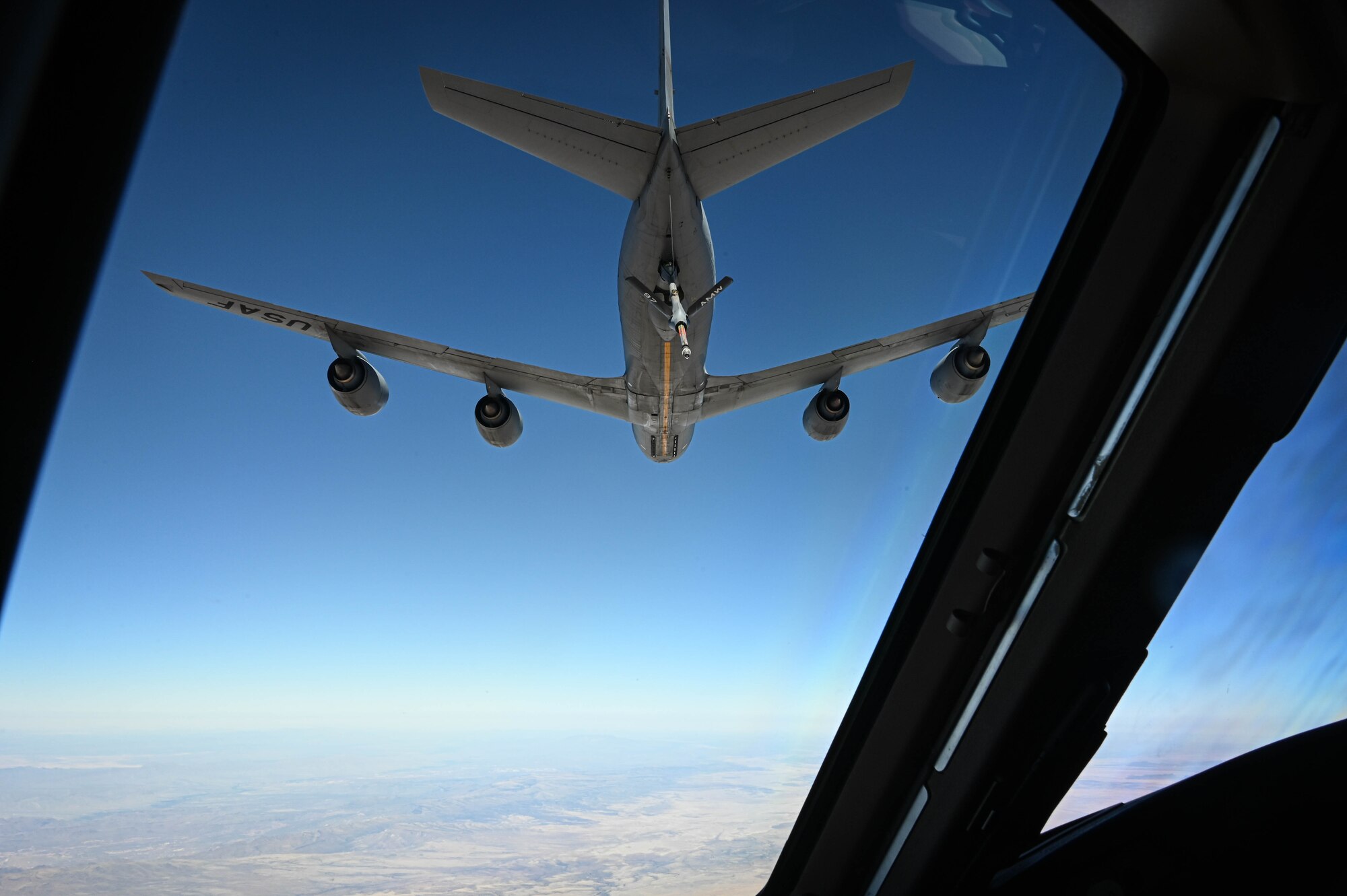 A KC-135 Stratotanker begins the air refueling process for a KC-46 Pegasus, March 10, 2022. The KC-135 is one of the first capable in-flight refueling aircraft, starting its service in 1956. (U.S. Air Force photo by Senior Airman Kayla Christenson)