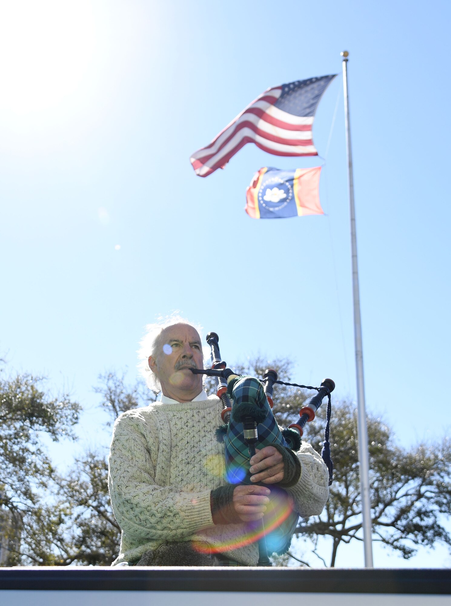 A bag pipe player performs during the Hibernia Marching Society of Mississippi St. Patrick's Day Parade in Biloxi, Mississippi, March 12, 2022. Keesler personnel participated in the local parade to show their support of the communities surrounding the installation. (U.S. Air Force photo by Kemberly Groue)