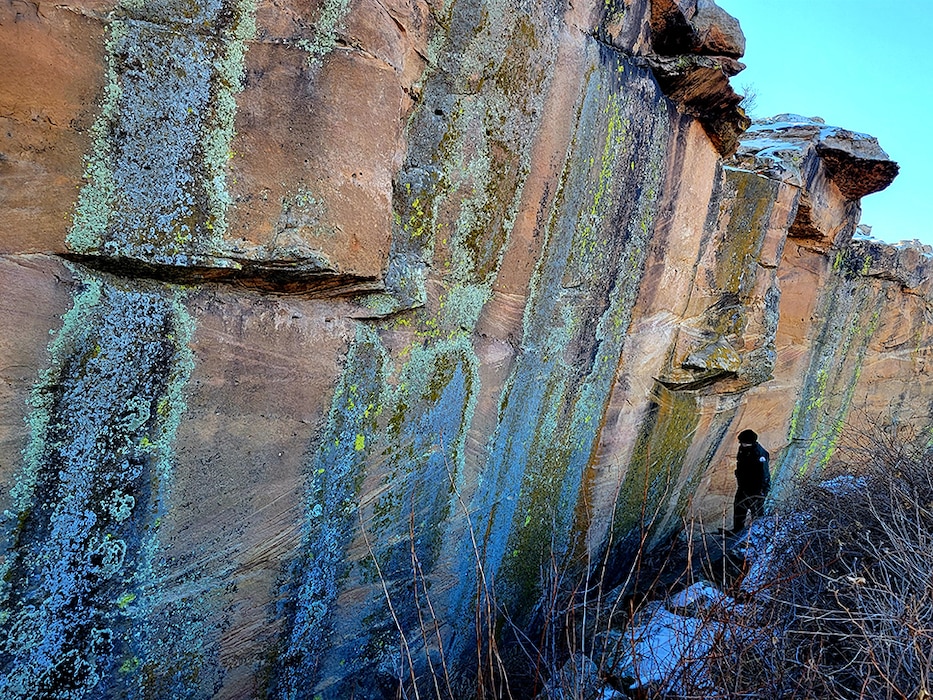 JOHN MARTIN RESERVOIR, Colo. -- A USACE park ranger searches a rock face near Hicklin Springs for hidden petroglyphs, Jan. 28, 2022. Photo by Holly Garnett.