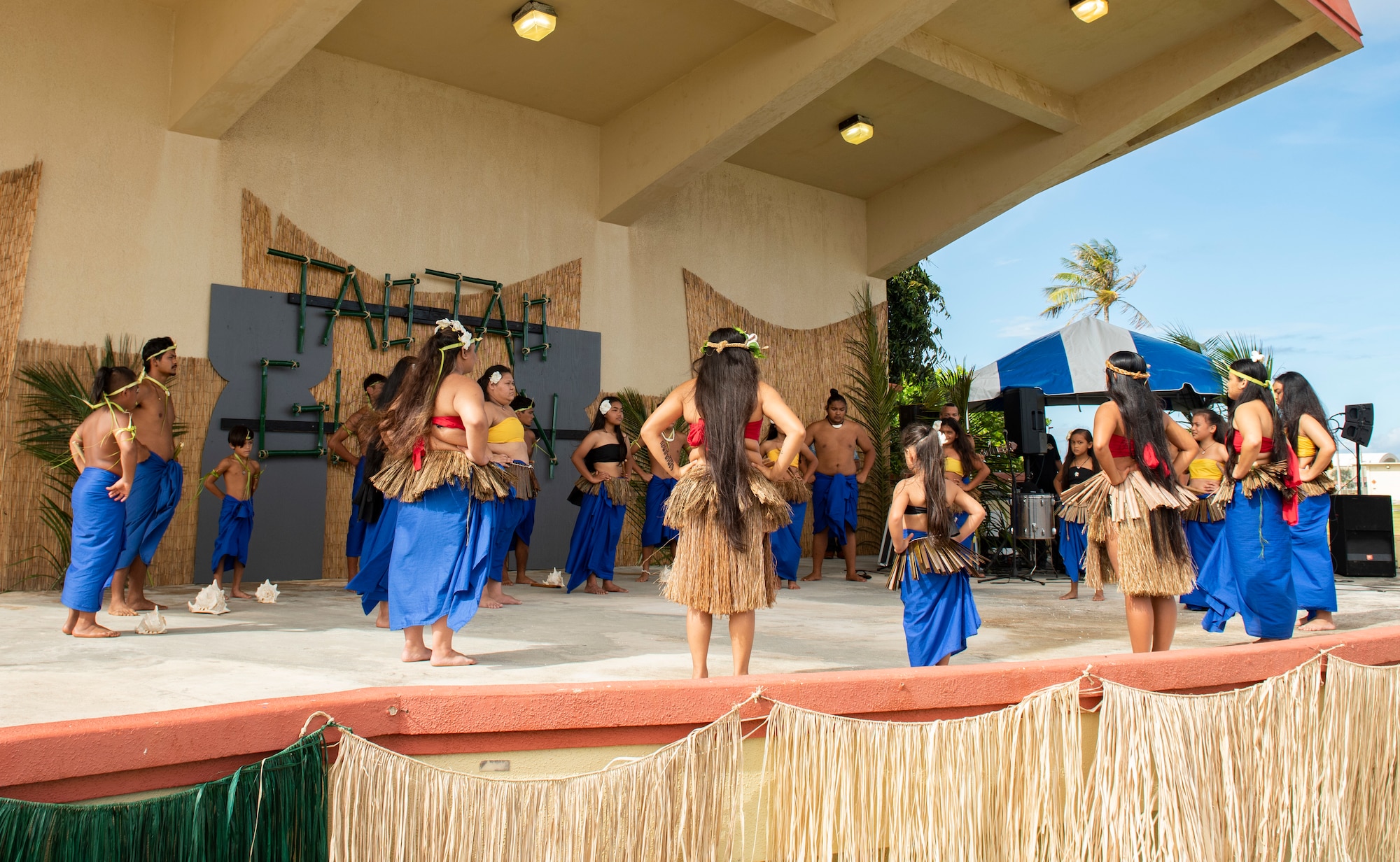 Cultural group, Guma Ma’higa, performs during the annual Tao Tao Guahan event March 12, 2022, at Andersen Air Force Base, Guam. The event focused on immersing Team Andersen members in the local culture of Guam and strengthen the partnerships of the two communities. The event included booths, cultural music and dance, storytelling, food and more. (U.S. Air Force Photo by Senior Airman Helena Owens)