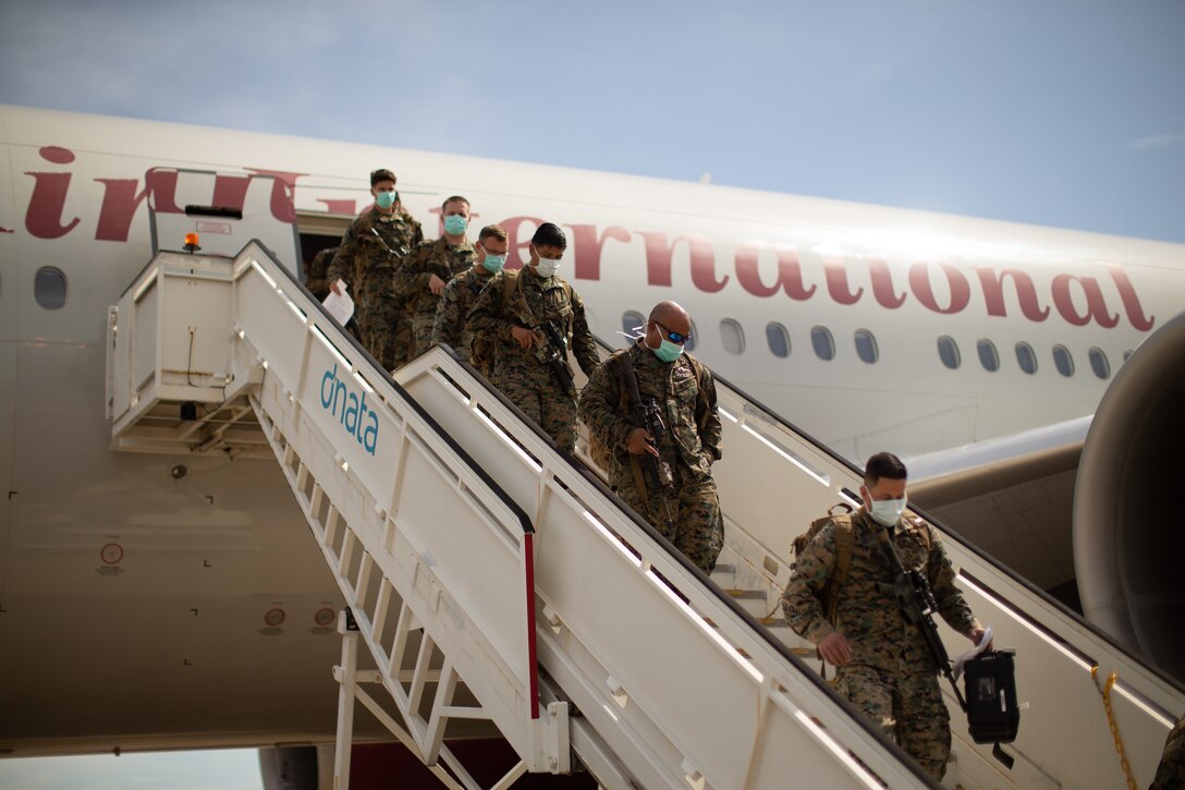 U.S. Marines with the Command Element, 5th Marine Regiment, Marine Rotational Force Darwin (MRF-D) 22 enter Royal Australian Air Force Base Darwin, NT, Australia, March 12, 2022. MRF-D 22 is a six month rotation where U.S. Marines, the Australian Defence Force, and other allied and partner nations enhance their interoperability and readiness posture in the Indo-Pacific region. (U.S. Marine Corps Photo by Cpl. Cedar Barnes)