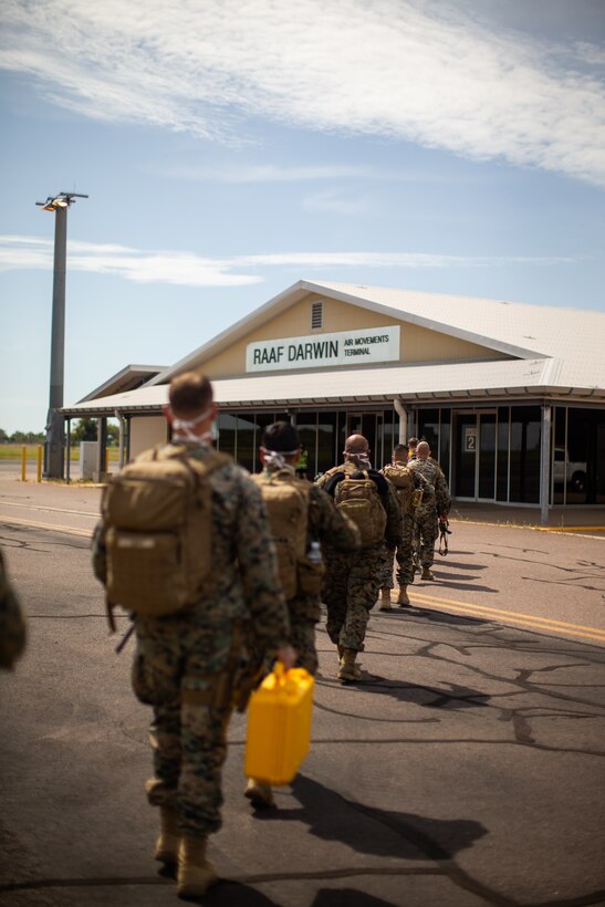 U.S. Marines with the Command Element, 5th Marine Regiment, Marine Rotational Force Darwin (MRF-D) 22 enter Royal Australian Air Force Base Darwin, NT, Australia, March 12, 2022. MRF-D 22 is a six month rotation where U.S. Marines, the Australian Defence Force, and other allied and partner nations enhance their interoperability and readiness posture in the Indo-Pacific region.