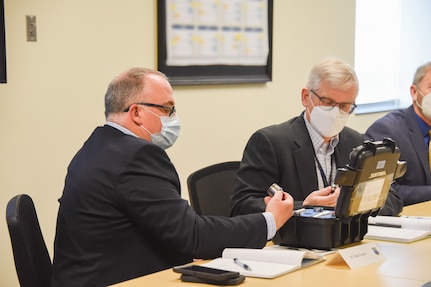 Mr. Eddie Preston, Rapid Sustainment Office and  Dr. Howard Sizek, Air Force Research Laboratory Liaison to Rapid Sustainment Office examine an EMI band replacement tool