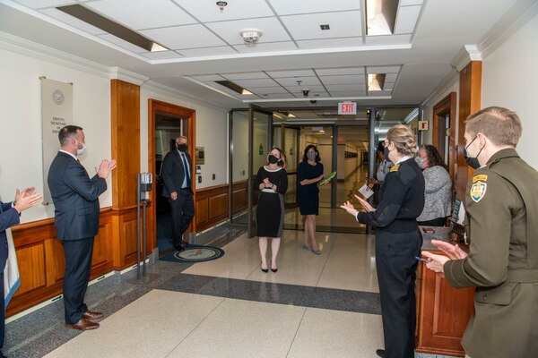 A woman is greeted at the Pentagon.