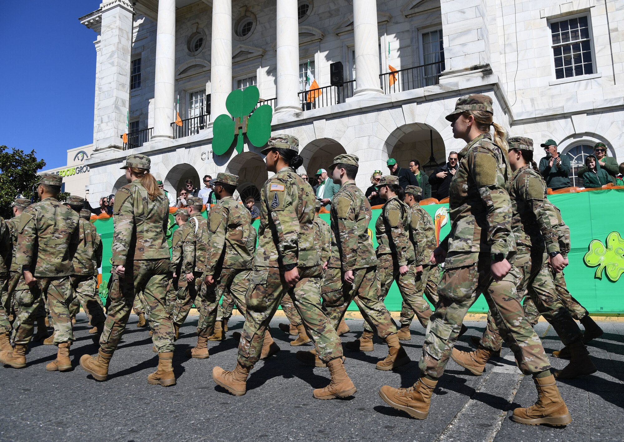 Airmen from the 81st Training Wing march through Biloxi during the Hibernia Marching Society of Mississippi St. Patrick's Day Parade in Biloxi, Mississippi, March 12, 2022. Keesler personnel participated in the local parade to show their support of the communities surrounding the installation. (U.S. Air Force photo by Kemberly Groue)