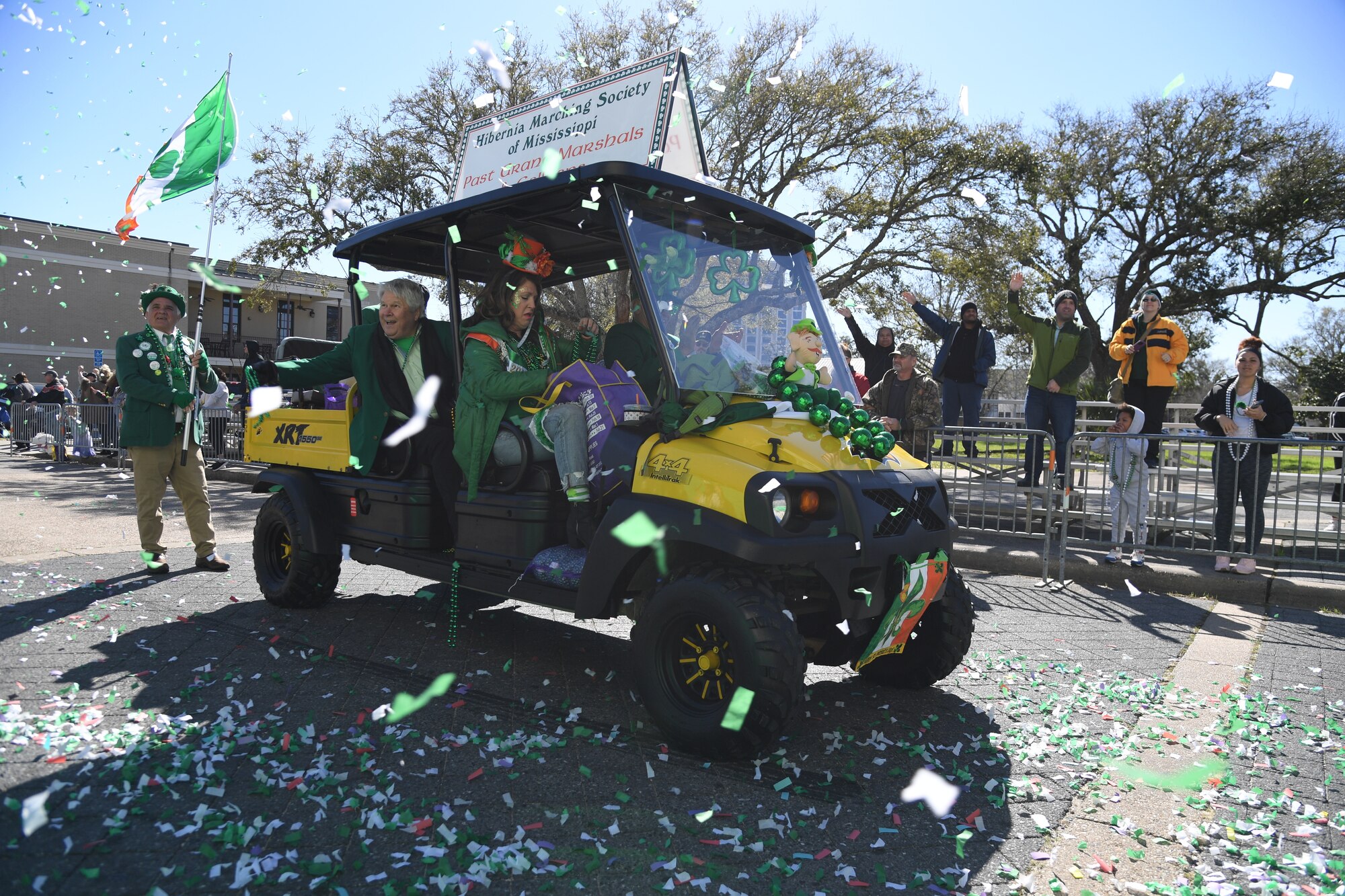 Decorative ATVs ride through Biloxi during the Hibernia Marching Society of Mississippi St. Patrick's Day Parade in Biloxi, Mississippi, March 12, 2022. Keesler personnel participated in the local parade to show their support of the communities surrounding the installation. (U.S. Air Force photo by Kemberly Groue)