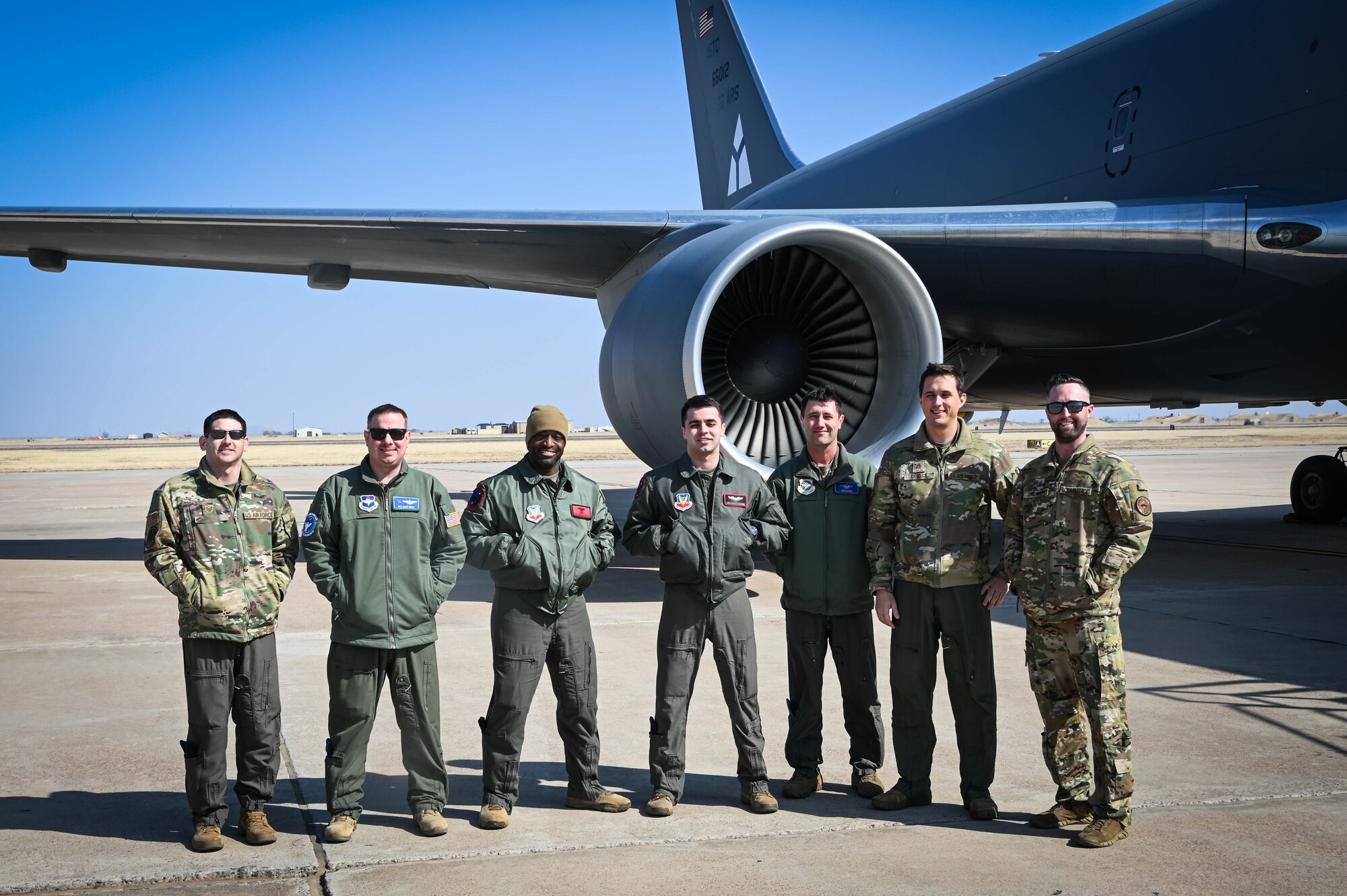 KC-46 Pegasus aircrew and sensor operators pose for a group photo after flying at Altus Air Force Base, Oklahoma, March 10, 2022. The crew completed several types of training during the flight, including receiving and giving air refueling, “touch and gos” and an auto-land full stop. (U.S. Air Force photo by Senior Airman Kayla Christenson)