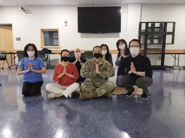 Far East District personnel participate in a Free Breathing, Meditation Yoga Class, at FED headquarters, March 7. This year’s theme “Providing Healing and Promoting Hope,” pays tribute to the ceaseless work of caregivers and recognizes the thousands of ways that women of all cultures have provided both healing and hope throughout history. (U.S. Army photo by An Yo-han)