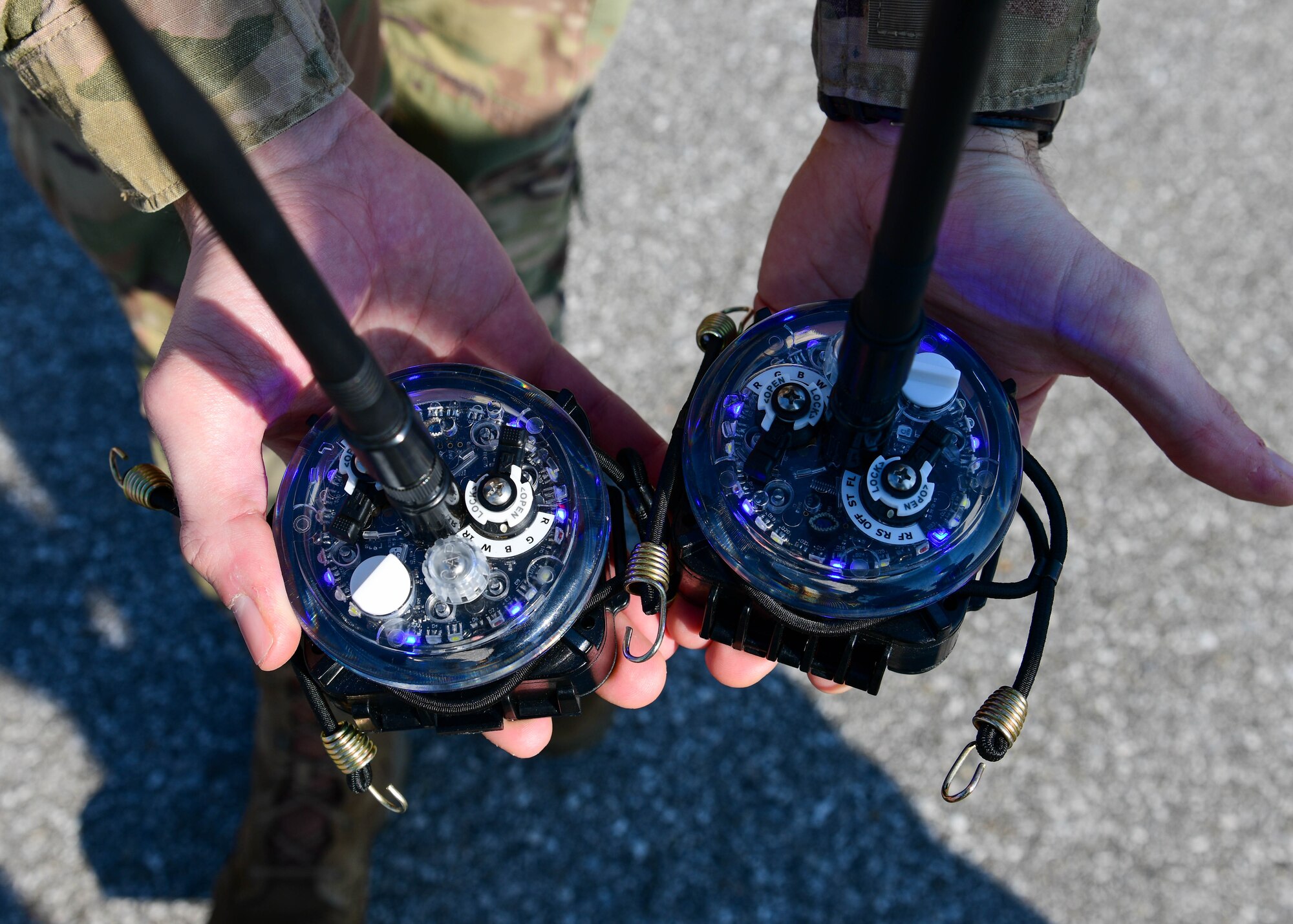 U.S. Air Force 1st Lt. Jeffrey Bliss, 31st Operations Support Squadron airfield operations director of operations, holds airfield lights during a training session at Aviano Air Base, Italy, March 10, 2022. U.S. Air Force Airmen assigned to the 31st OSS Air Traffic Control Tower and Airfield Management section trained with and tested Phantom AZL-15 lighting kits to become familiar with the airfield management contingency response procedures for C-17 Globemasters and C-130 Hercules. The Phantom AZL-15 lighting kit displays colors such as red, green, blue, white and infared. (U.S. Air Force photo by Senior Airman Brooke Moeder)