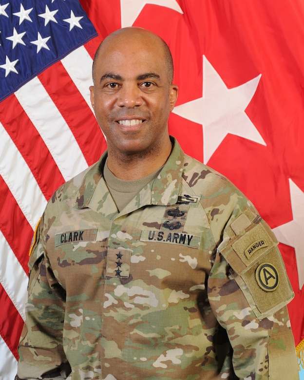 Portrait of Lieutenant General Ronald Clark, commanding general of U.S Army Central Command (ARCENT), stands in front of American flag.