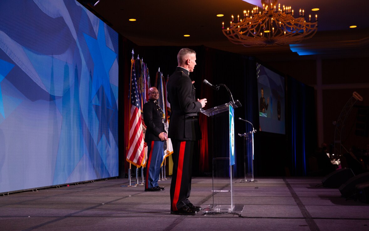Gen. Eric Smith, Assistant Commandant of the Marine Corps, presents an award to Col. Quintin Jones, the Marine of the Year, at the Stars and Stripes award ceremony at the Omni Shoreham Hotel in Washington D.C., February 18, 2022. Stars and Stripes held their 17th annual award ceremony this year honoring black American service members.