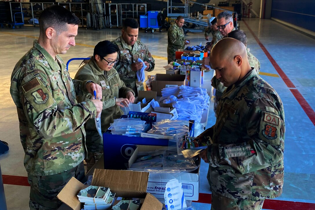 Airmen put together care packages that will be sent overseas and given to Ukranian refugees.