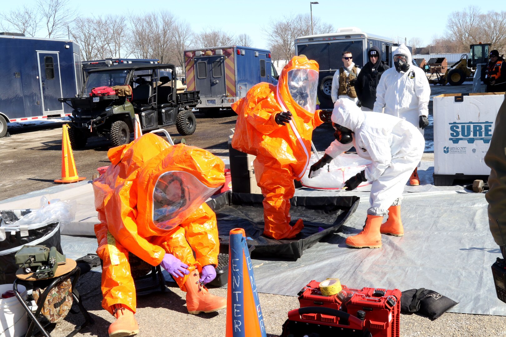 Members of the Wisconsin National Guard’s 54th Civil Support Team conduct decontamination procedures during a collective lanes training exercise in Madison, Wis., March 8, 2022. The Madison-based CST is the state’s full-time response team for emergencies or terrorist events that involve weapons of mass destruction, toxic industrial chemicals or natural disasters.
