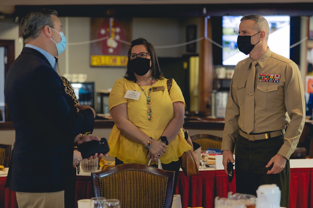 Dr. Stephen Hill, left, Pender County schools superintendent, and Ms. Mandi Gillis, center, Maysville Elementary School principal, speak with U.S. Marine Corps Brig. Gen. Andrew M. Niebel, right, Marine Corps Installations East (MCIEAST)-Marine Corps Base (MCB) Camp Lejeune commanding general, during a luncheon at Paradise Point Officers Club on MCB Camp Lejeune, North Carolina, March 3, 2022