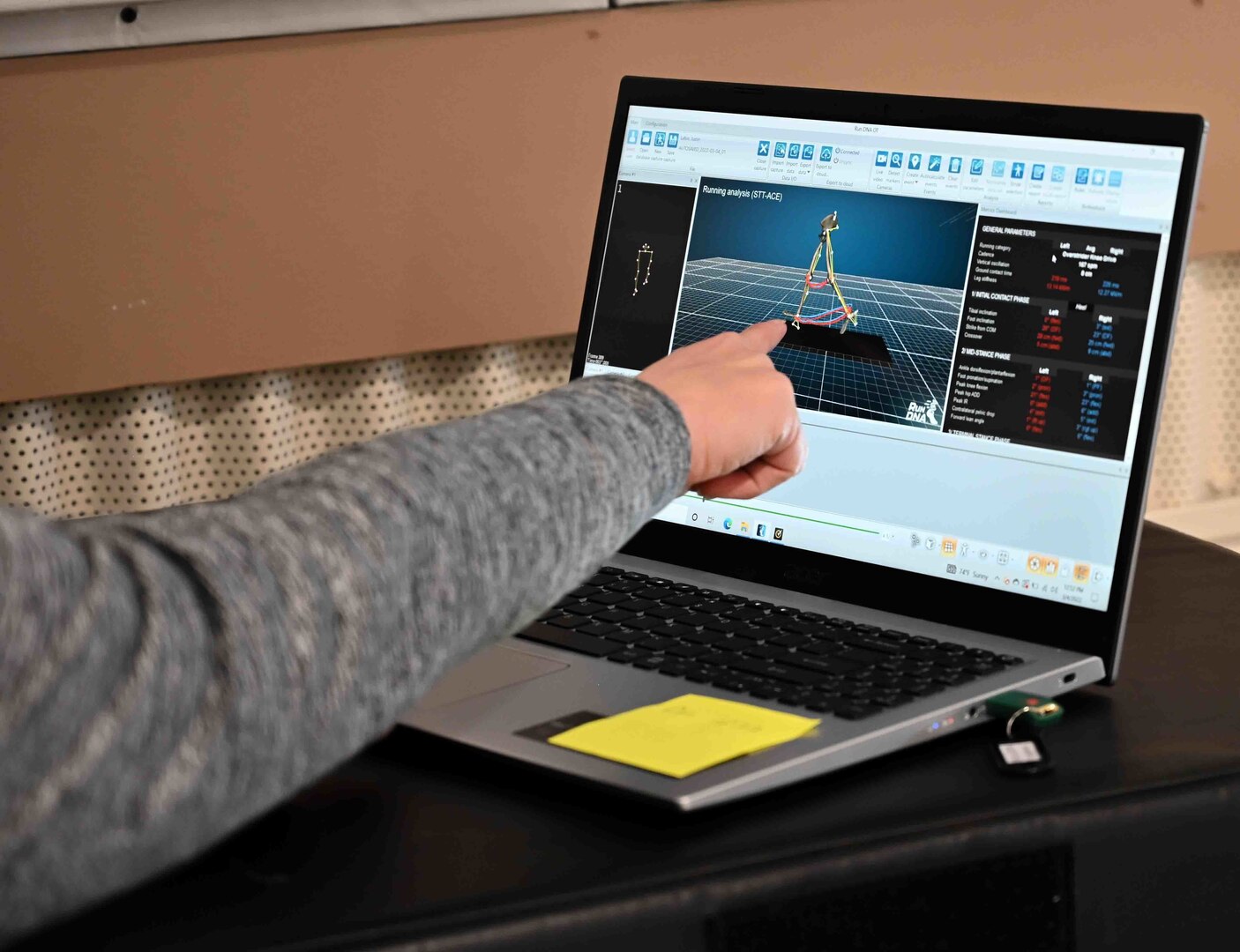 Amy Jones, a certified corrective exercise specialist at the 173rd Fighter Wing, Oregon Air National Guard, explains the mechanics of a runner's gait and stride captured using RunDNA technology March 4, 2022, at Kingsley Field in Klamath Falls, Ore. The system provides three-dimensional analysis previously only available to professional runners and helps correct problems that may cause injury while also helping create a faster, more efficient stride.