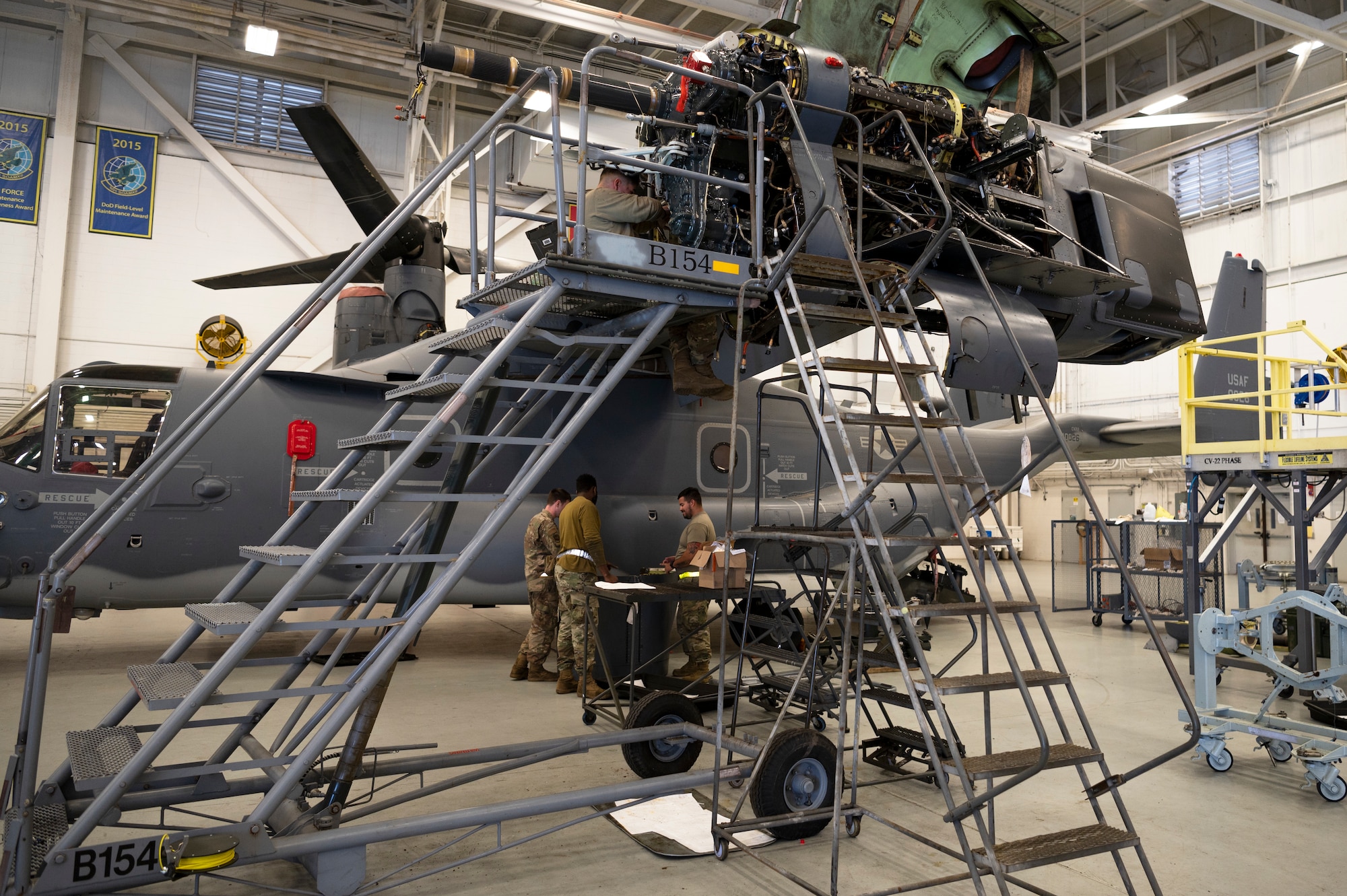 Airmen from the 801st Special Operations Aircraft Maintenance Squadron, work on a CV-22 Osprey during maintenance at Independence Hangar on Hurlburt Field, Fla., Feb15, 2022. The 801st SOAMXS's mission is to perform all equipment maintenance in support of worldwide special operations missions in response to national command authority taskings for the CV-22 Osprey supporting the 8th Special Operations Squadron.