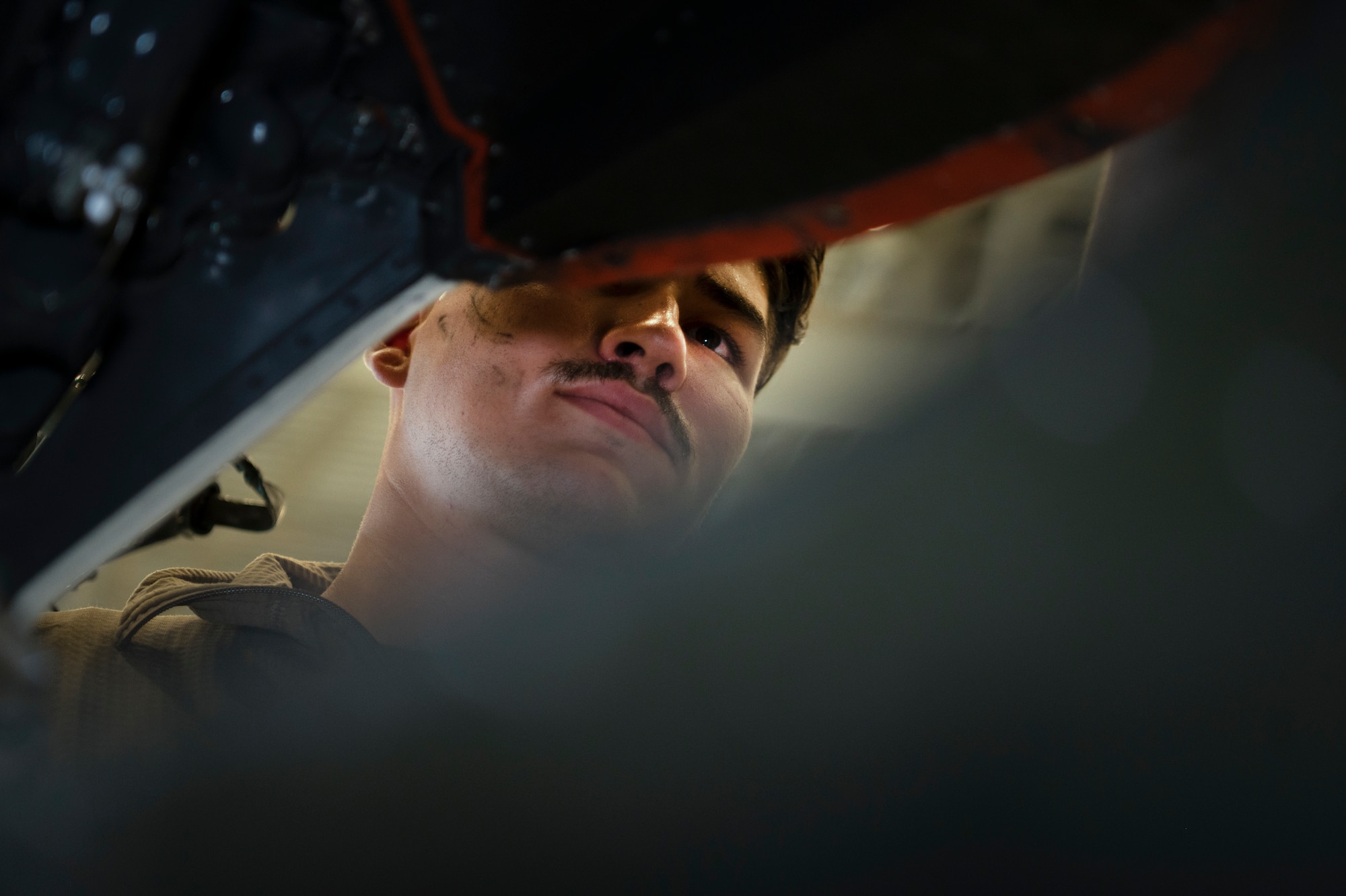 Senior Airman Thomas Perez, an 801st Special Operations Aircraft Maintenance Squadron CV-22 Osprey crew chief, reviews after installing an inboard proprotor gearbox horizontal fire baffle at Independence Hangar on Hurlburt Field, Fla., Feb15, 2022. The 801st SOAMXS's mission is to perform all equipment maintenance in support of worldwide special operations missions in response to national command authority taskings for the CV-22 Osprey supporting the 8th Special Operations Squadron.