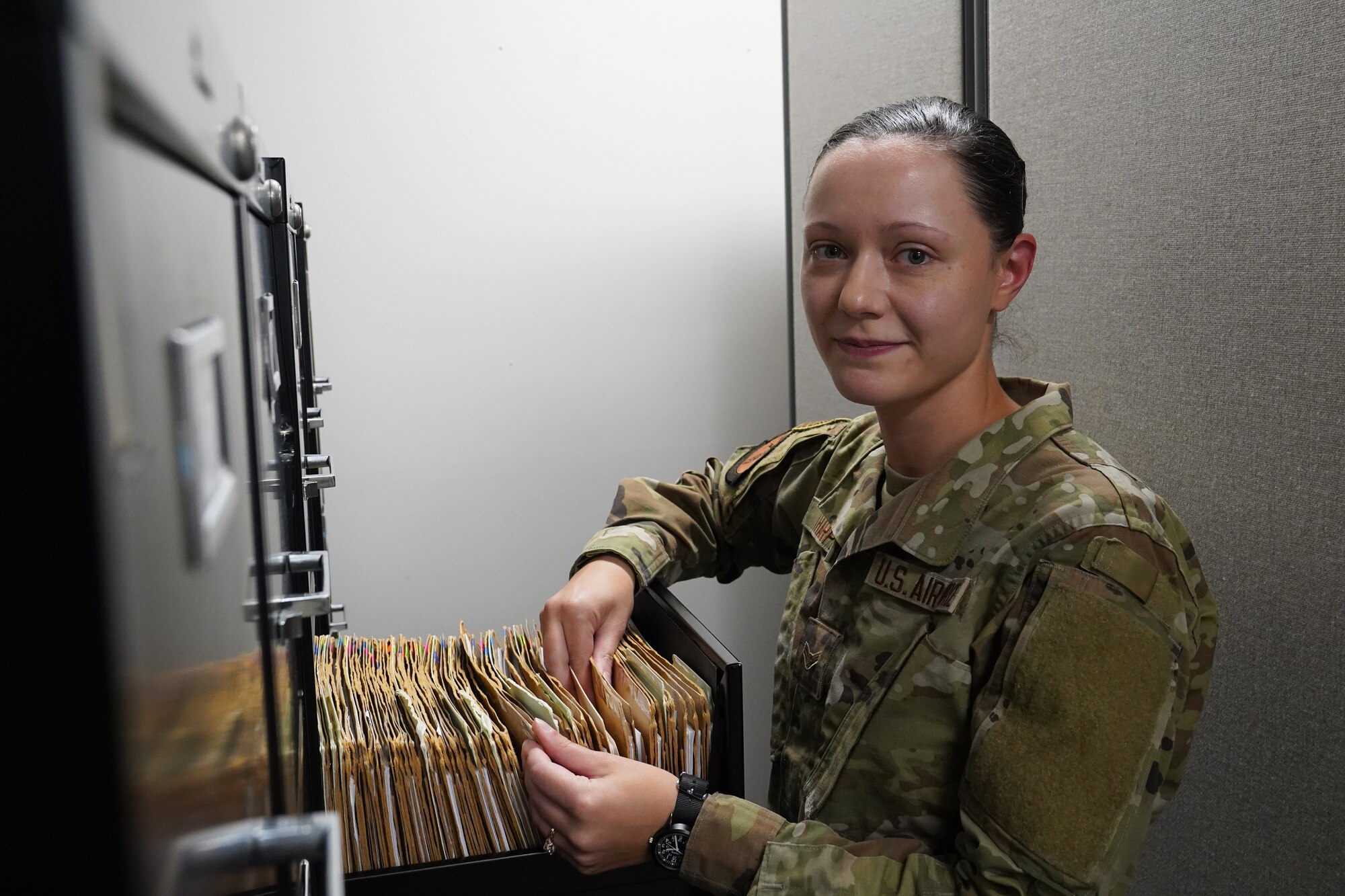 U.S Air Force Airman 1st Class Samantha Harper, 335th Training Squadron student, files paper work at the Levitow Building on Keesler Air Force Base, Mississippi, March 15, 2022. Harper took part in the Skills Enhancing Development Program, which allows Airmen who have graduated technical training the opportunity to work on their career field's local squadron, while waiting to leave for their first duty station. (U.S. Air Force photo by Airman 1st Class Trenten Walters)