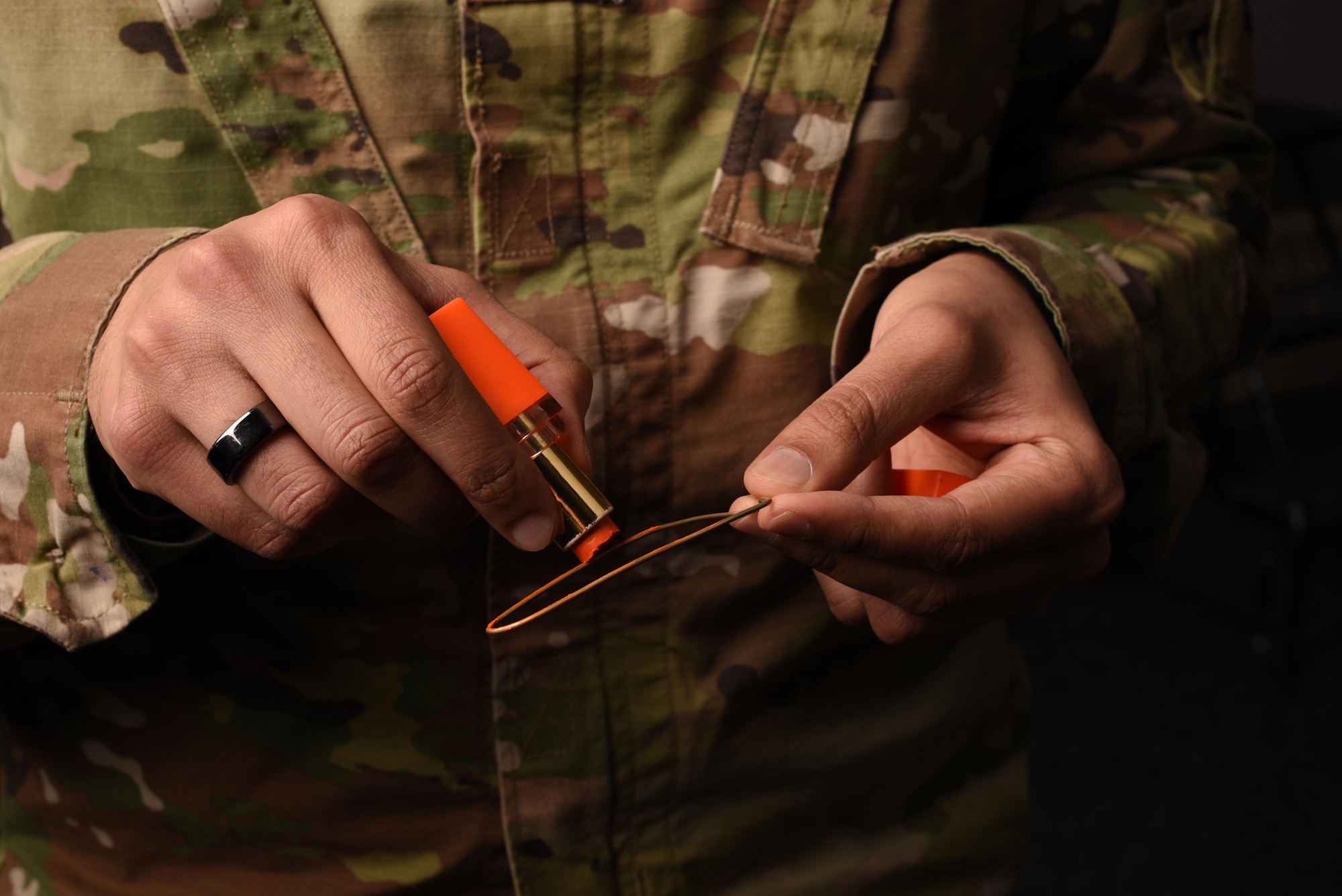 Senior Airman Darshan Shah, an aerospace medical technician assigned to the 90th Operational Medical Readiness Squadron, prepares to apply a Tilak Chandlo, a Hindu marking, on F.E. Warren Air Force Base, Wyoming, March 15, 2022. Shah received a waiver to wear the Tilak Chandlo in uniform on Feb. 22, 2022. (U.S. Air Force photo by Airman 1st Class Charles Munoz)