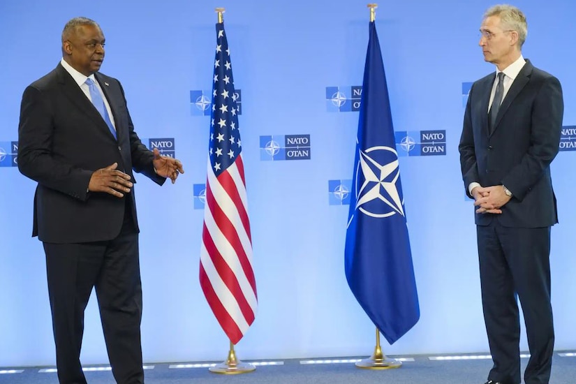 Secretary of Defense Lloyd J. Austin III speaks with NATO Secretary General Jens Stoltenberg.