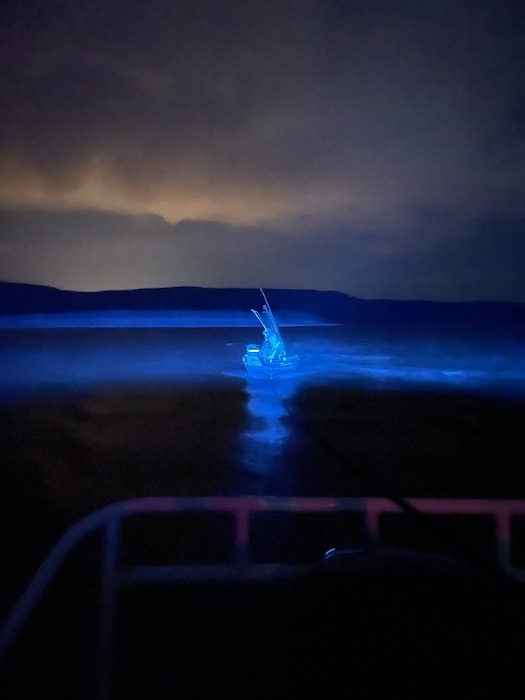 COCHITI LAKE, N.M. -- A boat broke down on the lake late at night and had a spooky look while being towed to the dock, June 17, 2021.  Photo by Karyn Matthews.