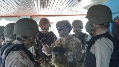 GULF OF OMAN (March 2, 2022) – Members of a multinational boarding team conduct a subject-matter-expert exchange aboard a fishing vessel in the Gulf of Oman, March 2. Participants included forces from Bahrain, Oman, Saudi Arabia, the United Arab Emirates and the United States. (U.S. Navy photo)