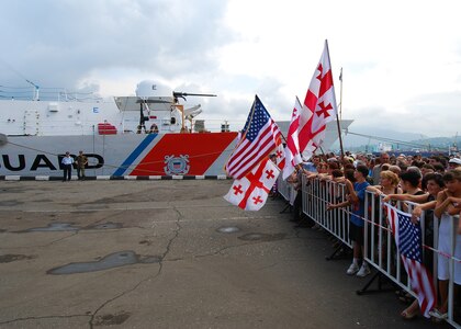 Local Georgians gather to welcome the crew of the U.S. Coast Guard Cutter Dallas. Dallas arrived with more than 76,000 pounds of humanitarian assistance supplies to be given to the people of Georgia.