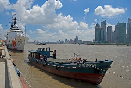 (Aug. 18, 2007) SHANGHAI, China - A boarding team, from the U.S. Coast Guard 378-foot High Endurance Cutter Boutwell, demonstrates along with the Chinese Coast Guard their specific boarding techniques and procedures on Saturday here. The crew from the Boutwell is representing the U.S. Coast Guard here and other foreign ports to help increase international maritime security and safety in the Northern Pacific Ocean and it's borders as part of the North Pacific Coast Guard Forum. (Coast Guard photo by Petty Officer Jonathan R. Cilley)