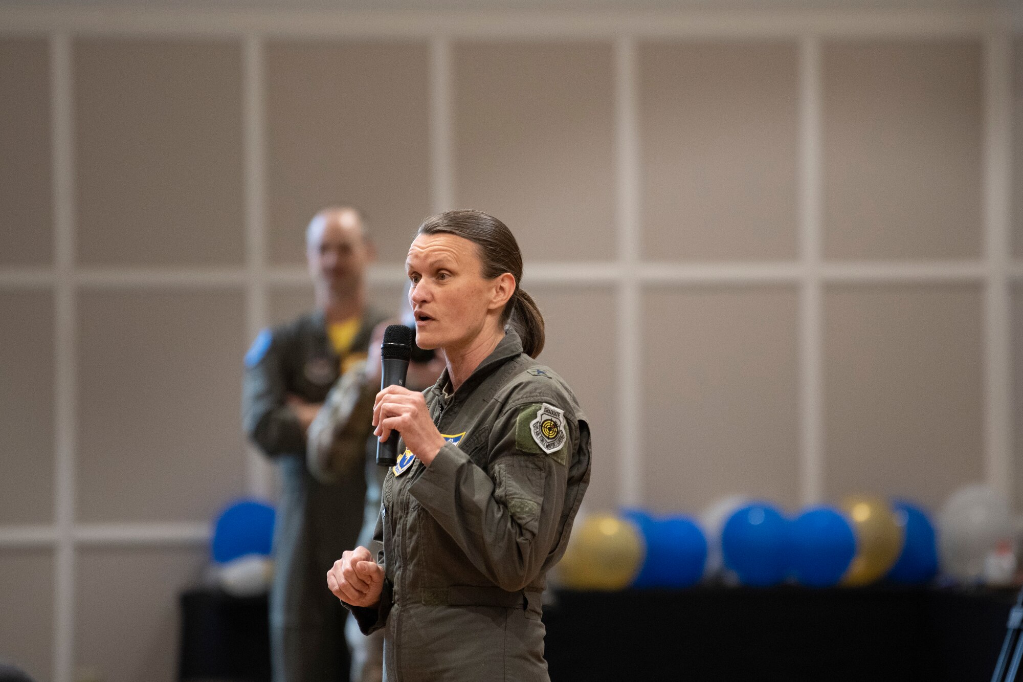 U.S. Air Force Brig. Gen. Leslie Maher, Jeanne M. Holm Center for Officer Accessions and Citizen Development commander, speaks during the Undergraduate Combat Systems Officer Training (UCT) Sapphire Event March 11, 2022, at Naval Air Station Pensacola, Florida.