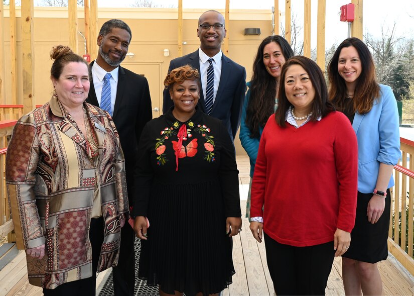 (Front) Teresa Quinn-Veseley, 11th Force Support Squadron; Shanee Johnson, Apple Tree at LEARN DC principal; Cherise Imai, executive director of the Military Interstate Children's Compact Commission; and (Back row) Horace Franklin, Naval District Washington school liaison; Alonso Hay, Joint Base Anacostia-Bolling school liaison; Andrea Groeninger, LEARN DC principal; and Commissioner Clara Botstein, director of legislation and government relations at the D.C. office of the deputy mayor for education, pose for a group photo on March 15, 2022 on the campus of the first charter school on JBAB, Washington, D.C. Botstein and Imai toured JBAB, Washington, D.C. and met members of the 11th Force Support Squadron and the LEARN DC team in order to gain a deeper understanding of the concerted interagency effort that made the school possible, as well as to learn about the diverse mission partners that operate on the installation. (U.S. Air Force photo by Staff Sgt. Kayla White)