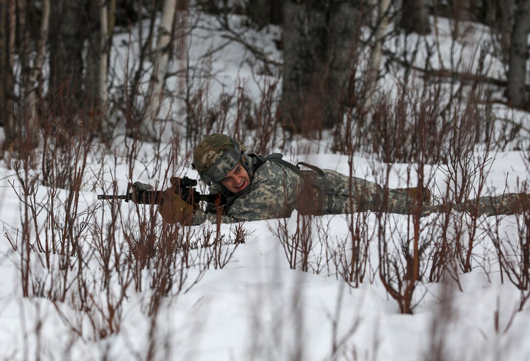 Alaska Army National Guard Sgt. Brendan White with Avalanche Company, 1-297th Infantry Battalion, participates in squad and platoon situational training exercises (STX) at Alcantra armory in Wasilla, Alaska, March 11, 2022. An STX is a short, scenario-driven, mission-oriented exercise designed to train one collective task or a group of related tasks or battle drills. For the A-Co. Soldiers, the STX allows for evaluation of basic Soldier skills and leadership competencies to determine proficiency and certify the platoon to conduct live-fire exercises. It also reinforces previous training that the Soldiers have completed by bringing the entire platoon together to further prepare the unit for live-fire training. The infantrymen are preparing to participate in the Army National Guard’s eXportable Combat Training Capability (XCTC) program, which is a brigade field training exercise similar to a Combat Training Center. They will participate in an XCTC rotation at Camp Roberts, California, July 2022. (U.S. Army National Guard photo by Spc. Grace Nechanicky)