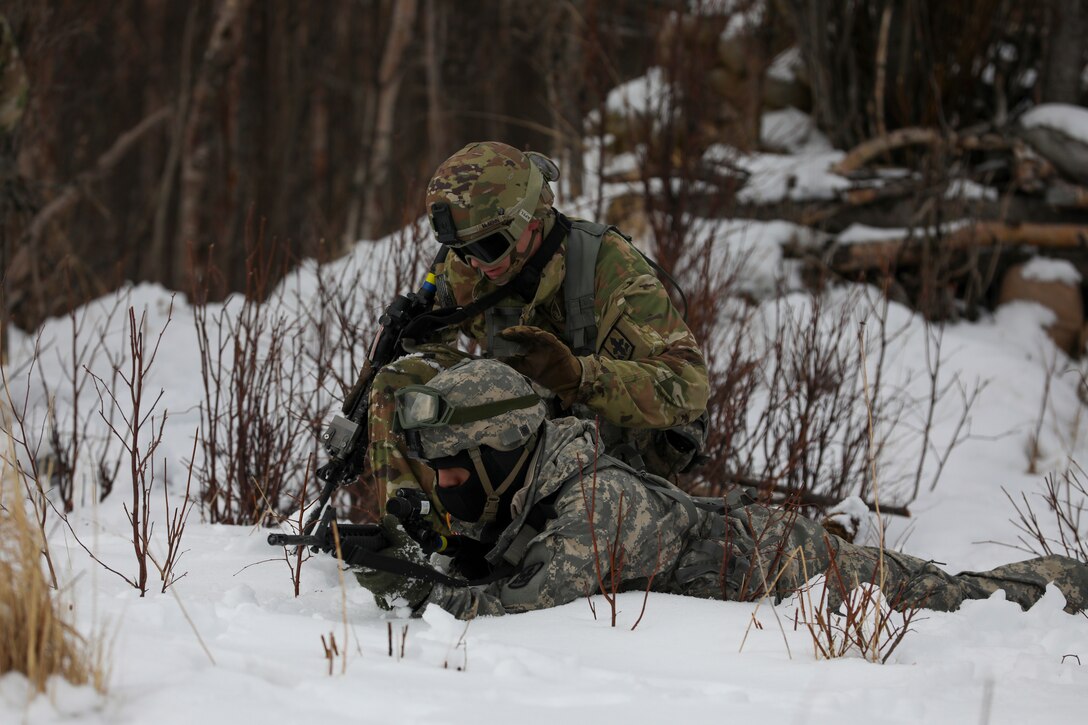 Alaska Army National Guard Soldiers with Avalanche Company, 1-297th Infantry Battalion, practice squad and platoon situational training exercises (STX) at Alcantra armory in Wasilla, Alaska, March 11, 2022. An STX is a short, scenario-driven, mission-oriented exercise designed to train one collective task or a group of related tasks or battle drills. For the A-Co. Soldiers, the STX allows for evaluation of basic Soldier skills and leadership competencies to determine proficiency and certify the platoon to conduct live-fire exercises. It also reinforces previous training that the Soldiers have completed by bringing the entire platoon together to further prepare the unit for live-fire training. The infantrymen are preparing to participate in the Army National Guard’s eXportable Combat Training Capability (XCTC) program, which is a brigade field training exercise similar to a Combat Training Center. They will participate in an XCTC rotation at Camp Roberts, California, July 2022. (U.S. Army National Guard photo by Spc. Grace Nechanicky)