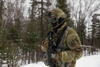 Alaska Army National Guard Spc. David McMinn with Avalanche Company, 1-297th Infantry Battalion, participates in squad and platoon situational training exercises (STX) at Alcantra armory in Wasilla, Alaska, March 11, 2022. An STX is a short, scenario-driven, mission-oriented exercise designed to train one collective task or a group of related tasks or battle drills. For the A-Co. Soldiers, the STX allows for evaluation of basic Soldier skills and leadership competencies to determine proficiency and certify the platoon to conduct live-fire exercises. It also reinforces previous training that the Soldiers have completed by bringing the entire platoon together to further prepare the unit for live-fire training. The infantrymen are preparing to participate in the Army National Guard’s eXportable Combat Training Capability (XCTC) program, which is a brigade field training exercise similar to a Combat Training Center. They will participate in an XCTC rotation at Camp Roberts, California, July 2022. (U.S. Army National Guard photo by Spc. Grace Nechanicky)