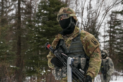 Alaska Army National Guard Soldiers with Avalanche Company, 1-297th Infantry Battalion, practice squad and platoon situational training exercises (STX) at Alcantra armory in Wasilla, Alaska, March 11, 2022. An STX is a short, scenario-driven, mission-oriented exercise designed to train one collective task or a group of related tasks or battle drills. For the A-Co. Soldiers, the STX allows for evaluation of basic Soldier skills and leadership competencies to determine proficiency and certify the platoon to conduct live-fire exercises. It also reinforces previous training that the Soldiers have completed by bringing the entire platoon together to further prepare the unit for live-fire training. The infantrymen are preparing to participate in the Army National Guard’s eXportable Combat Training Capability (XCTC) program, which is a brigade field training exercise similar to a Combat Training Center. They will participate in an XCTC rotation at Camp Roberts, California, July 2022. (U.S. Army National Guard photo by Spc. Grace Nechanicky)