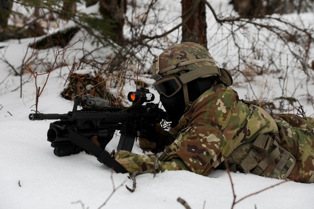 Alaska Army National Guard Soldiers with Avalanche Company, 1-297th Infantry Battalion, practice squad and platoon situational training exercises (STX) at Alcantra armory in Wasilla, Alaska, March 11, 2022. An STX is a short, scenario-driven, mission-oriented exercise designed to train one collective task or a group of related tasks or battle drills. For the A-Co. Soldiers, the STX allows for evaluation of basic Soldier skills and leadership competencies to determine proficiency and certify the platoon to conduct live-fire exercises. It also reinforces previous training that the Soldiers have completed by bringing the entire platoon together to further prepare the unit for live-fire training. The infantrymen are preparing to participate in the Army National Guard’s eXportable Combat Training Capability (XCTC) program, which is a brigade field training exercise similar to a Combat Training Center. They will participate in an XCTC rotation at Camp Roberts, California, July 2022. (U.S. Army National Guard photo by Spc. Grace Nechanicky)