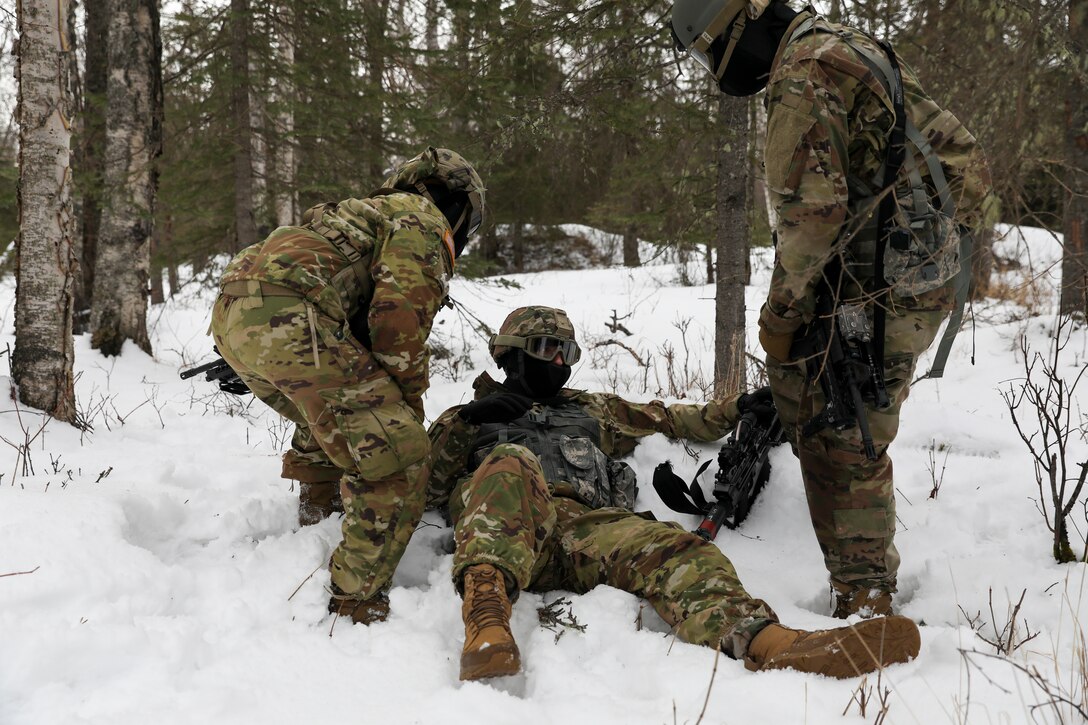 Alaska Army National Guard Soldiers with Avalanche Company, 1-297th Infantry Battalion, practice squad and platoon situational training exercises (STX) at Alcantra armory in Wasilla, Alaska, March 11, 2022. An STX is a short, scenario-driven, mission-oriented exercise designed to train one collective task or a group of related tasks or battle drills. For the A-Co. Soldiers, the STX allows for evaluation of basic Soldier skills and leadership competencies to determine proficiency and certify the platoon to conduct live-fire exercises. It also reinforces previous training that the Soldiers have completed by bringing the entire platoon together to further prepare the unit for live-fire training. The infantrymen are preparing to participate in the Army National Guard’s eXportable Combat Training Capability (XCTC) program, which is a brigade field training exercise similar to a Combat Training Center. They will participate in an XCTC rotation at Camp Roberts, California, July 2022. (U.S. Army National Guard photo by Spc. Grace Nechanicky)