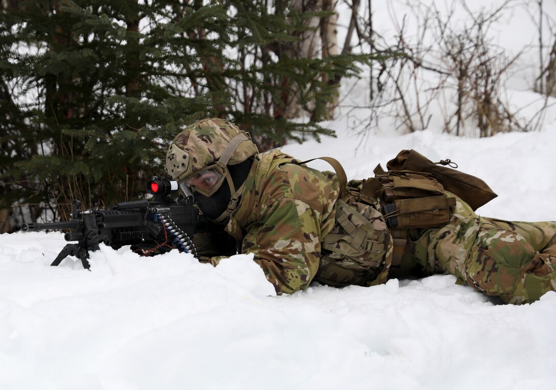 Alaska Army National Guard Soldiers with Avalanche Company, 1-297th Infantry Battalion, practice squad and platoon situational training exercises (STX) at Alcantra armory in Wasilla, Alaska, March 11, 2022. An STX is a short, scenario-driven, mission-oriented exercise designed to train one collective task or a group of related tasks or battle drills. For the A-Co. Soldiers, the STX allows for evaluation of basic Soldier skills and leadership competencies to determine proficiency and certify the platoon to conduct live-fire exercises. It also reinforces previous training that the Soldiers have completed by bringing the entire platoon together to further prepare the unit for live-fire training. The infantrymen are preparing to participate in the Army National Guard’s eXportable Combat Training Capability (XCTC) program, which is a brigade field training exercise similar to a Combat Training Center. They will participate in an XCTC rotation at Camp Roberts, California, July 2022. (U.S. Army National Guard photo by Spc. Grace Nechanicky)