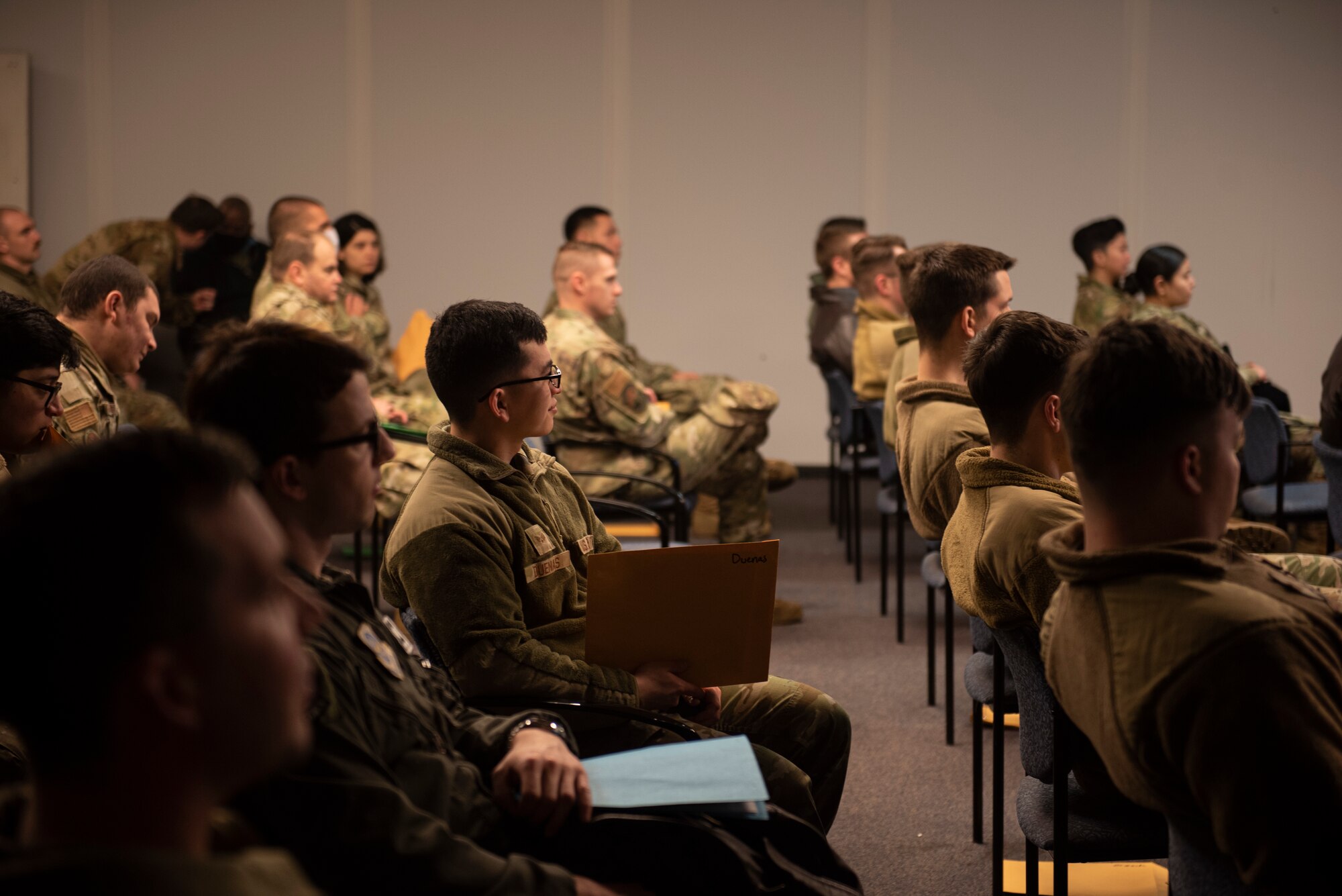 U.S. Air Force Airmen receive deployment briefings as part of Exercise Rainier War 22A at Joint Base Lewis-McChord, Washington, March 15, 2022. Rainier War 22A exercised and evaluated the wing’s ability to employ the force and its  ability to perform during wartime and/or contingency taskings in a high-intensity, wartime contested, degraded and operationally limited environment while supporting the contingency operations against a near-peer adversary. (U.S. Air Force photo by Master Sgt. Julius Delos Reyes)