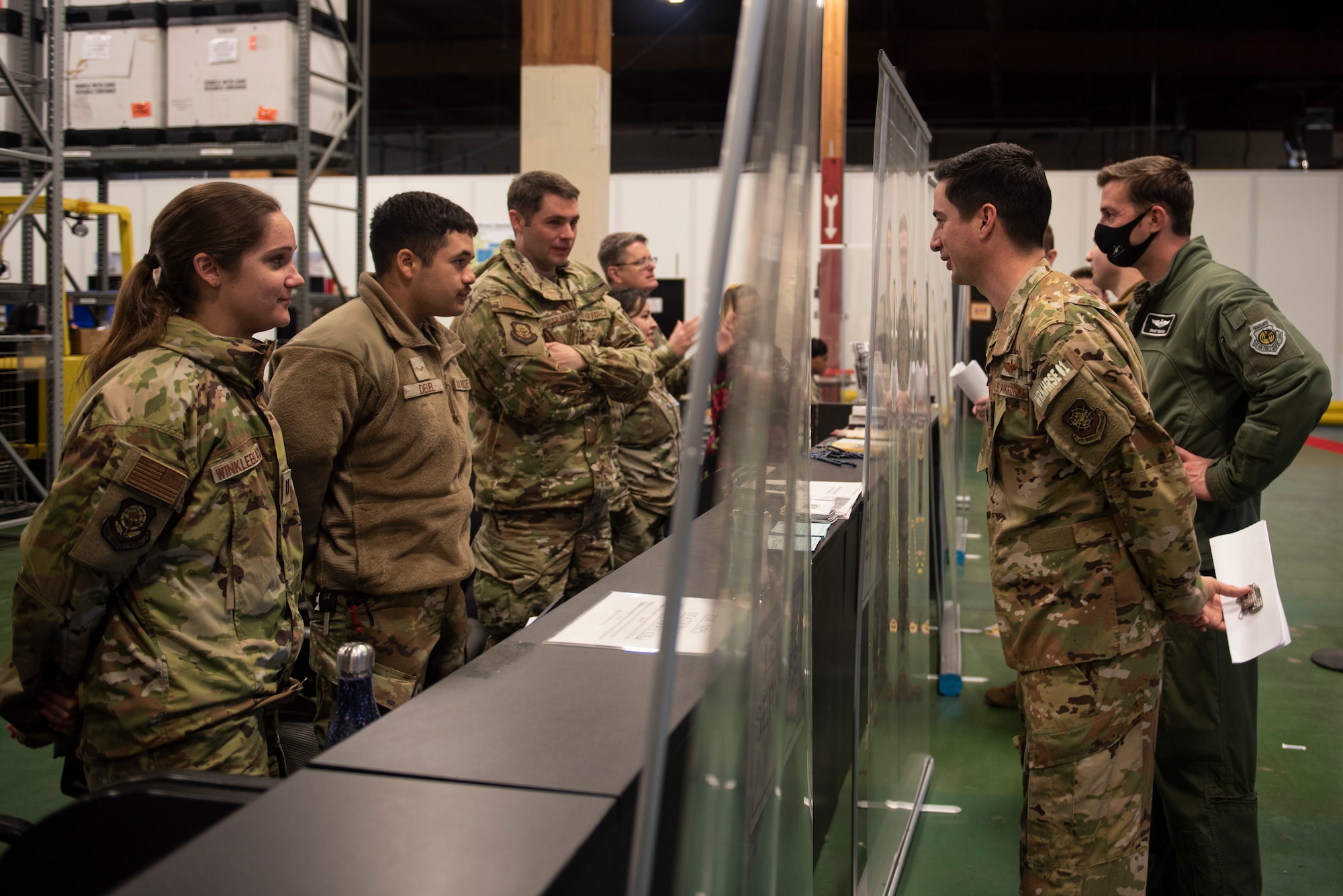 U.S. Air Force Airmen process through the deployment line as part of Exercise Rainier War 22A at Joint Base Lewis-McChord, Washington, March 15, 2022. Rainier War 22A exercised and evaluated the wing’s ability to employ the force and its  ability to perform during wartime and/or contingency taskings in a high-intensity, wartime contested, degraded and operationally limited environment while supporting the contingency operations against a near-peer adversary. (U.S. Air Force photo by Master Sgt. Julius Delos Reyes)