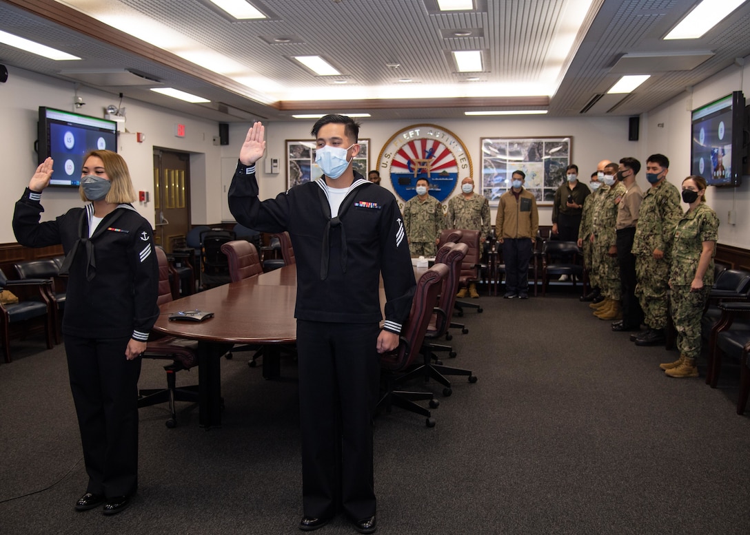 Sailors pledge the Naturalization Oath of Allegiance to the United States of America during a naturalization ceremony at CFAS March 14, 2022.